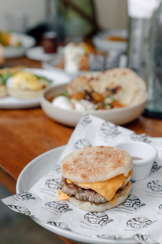 House sausage and egg breakfast muffin sandwich with melted cheddar